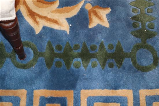 A Chinese blue ground carpet with Greek key border 480 x 365cm
